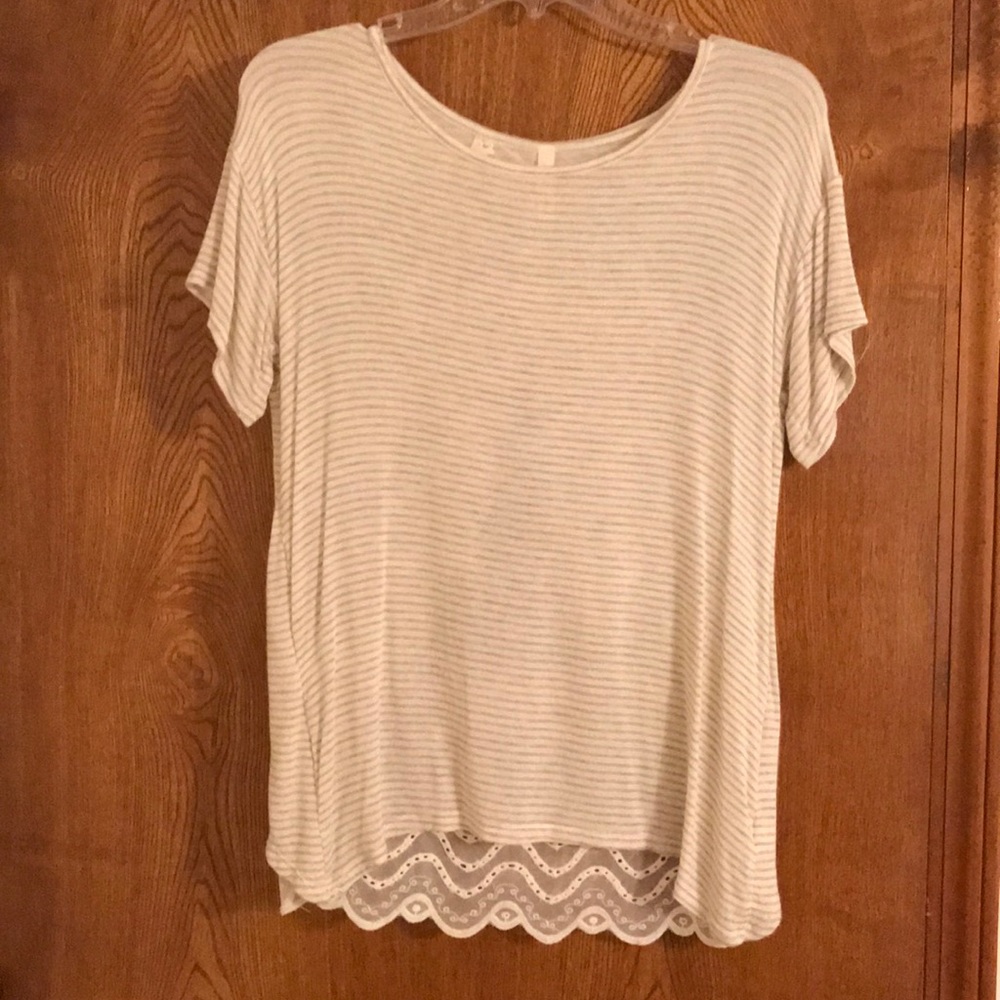 Small tan and white short sleeve shirt.